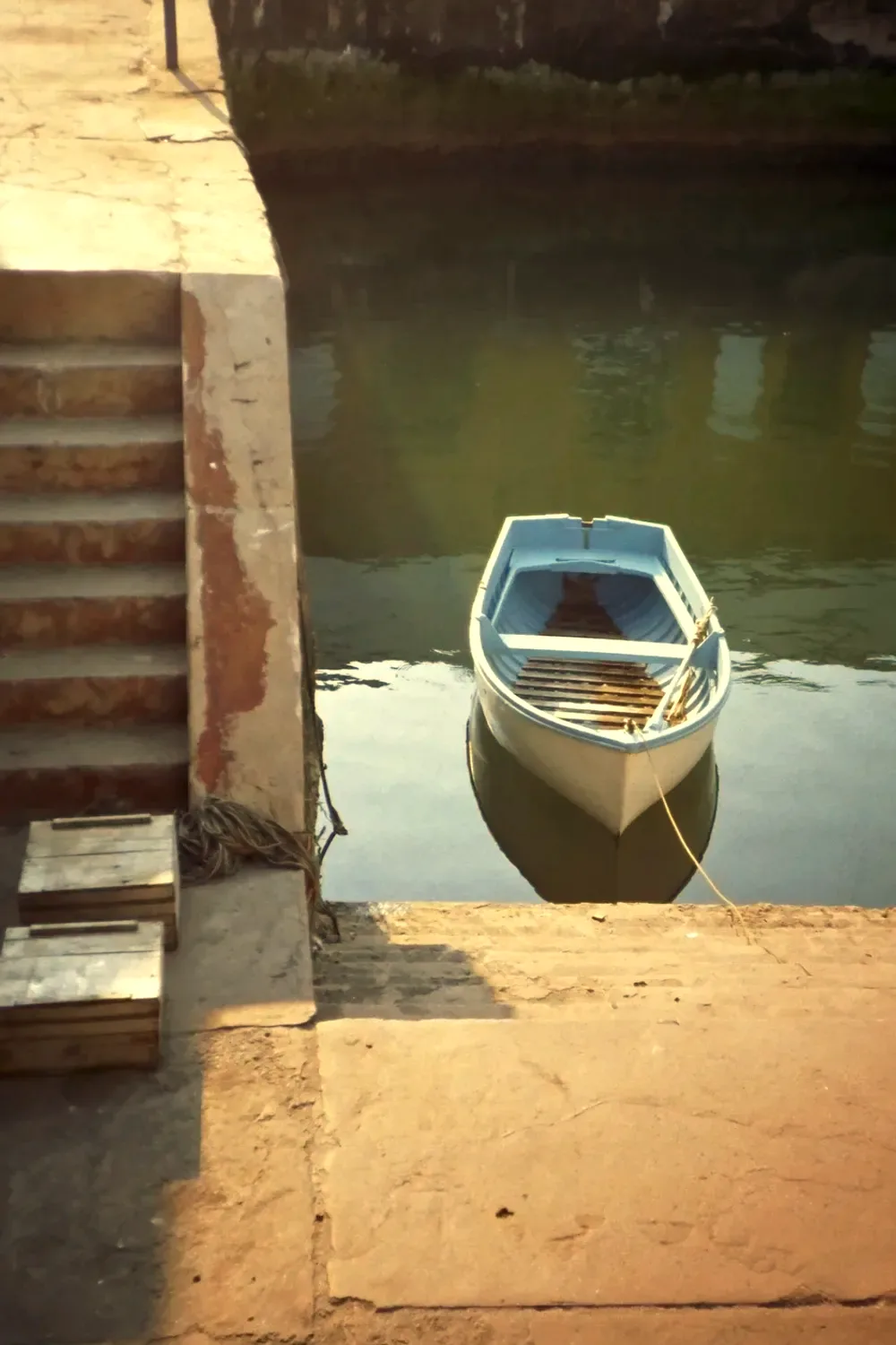 A rowing boat by harbour steps, warm colour recipe